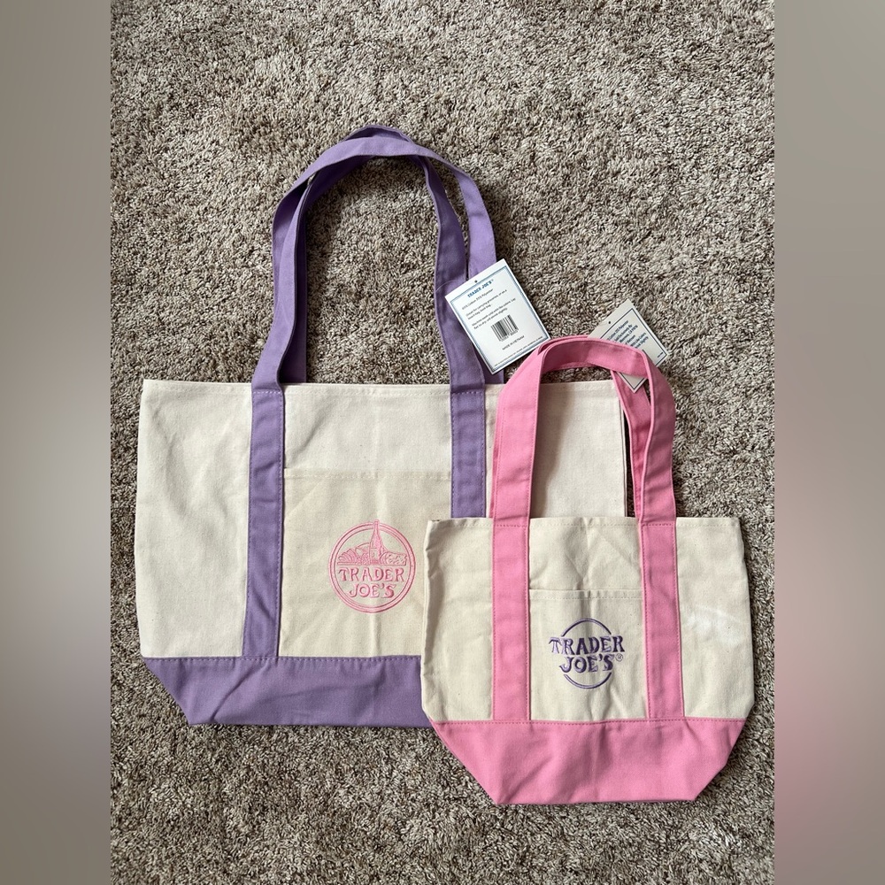 1 large lavender and 1 mini pink trader joe’s tote
